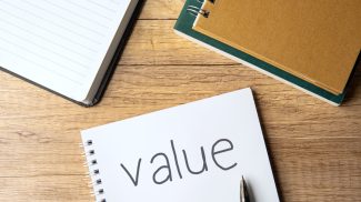 A notebook with the word "value".