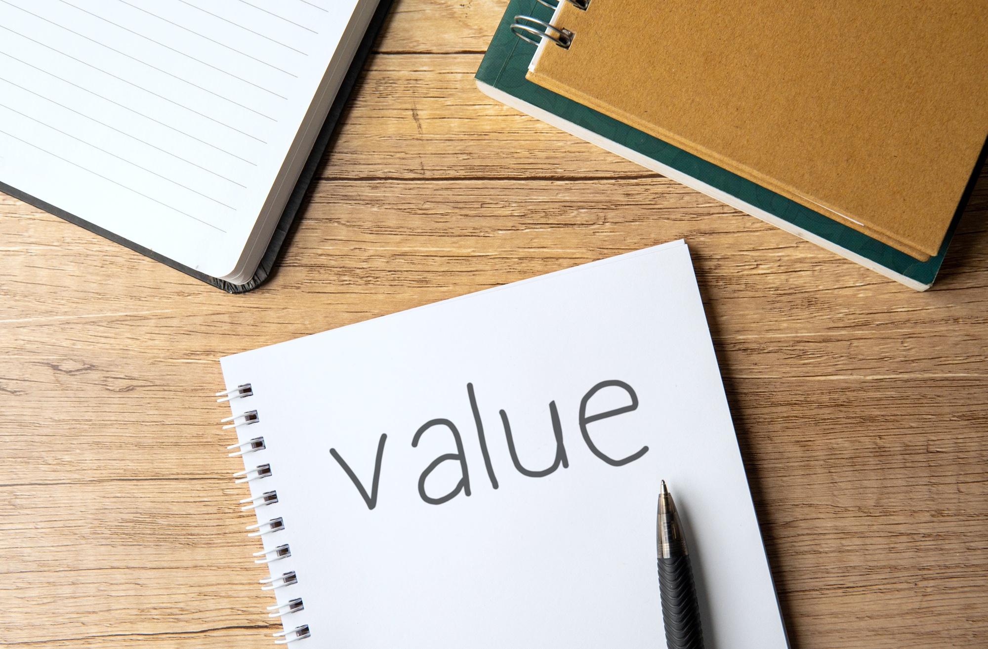 A notebook with the word "value".