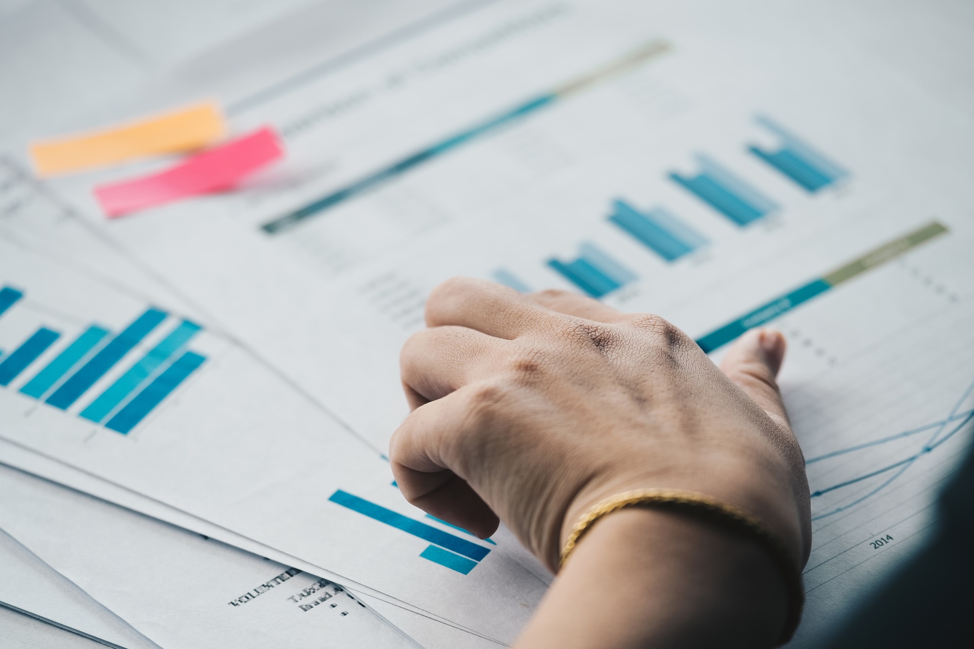 Business woman analysis many financial documents, tax, accounting,