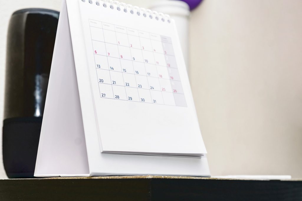 Calendar stands on a shelf. Deadline and office concept
