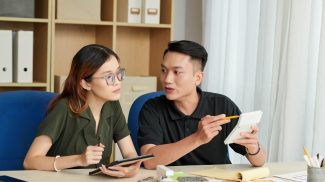 Coworkers Discussing Cost Estimation