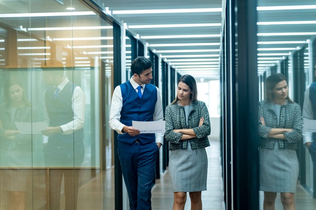 Diverse corporate team working together in modern meeting room office.