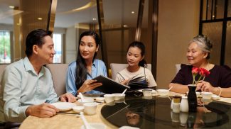 Family Examining Menu In The Restaurant