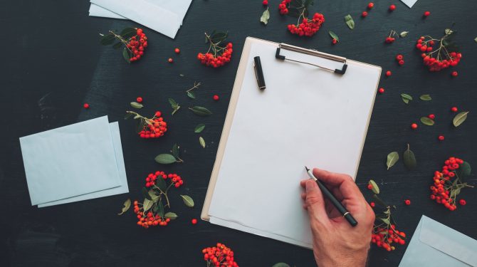 Flat lay hand writing letter