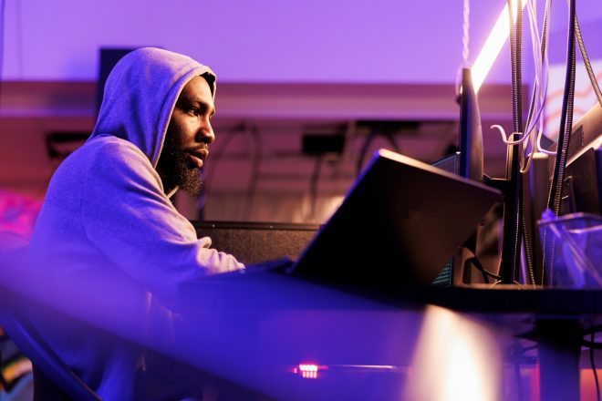 Hacker breaking law, coding ransomware