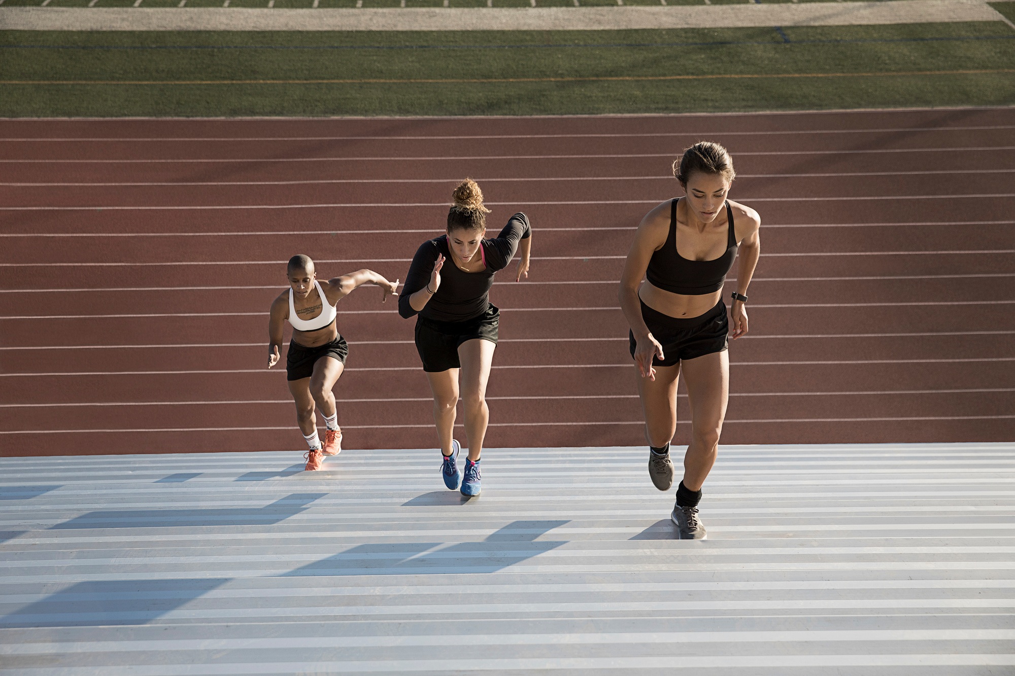 High angle view of woman running up steps