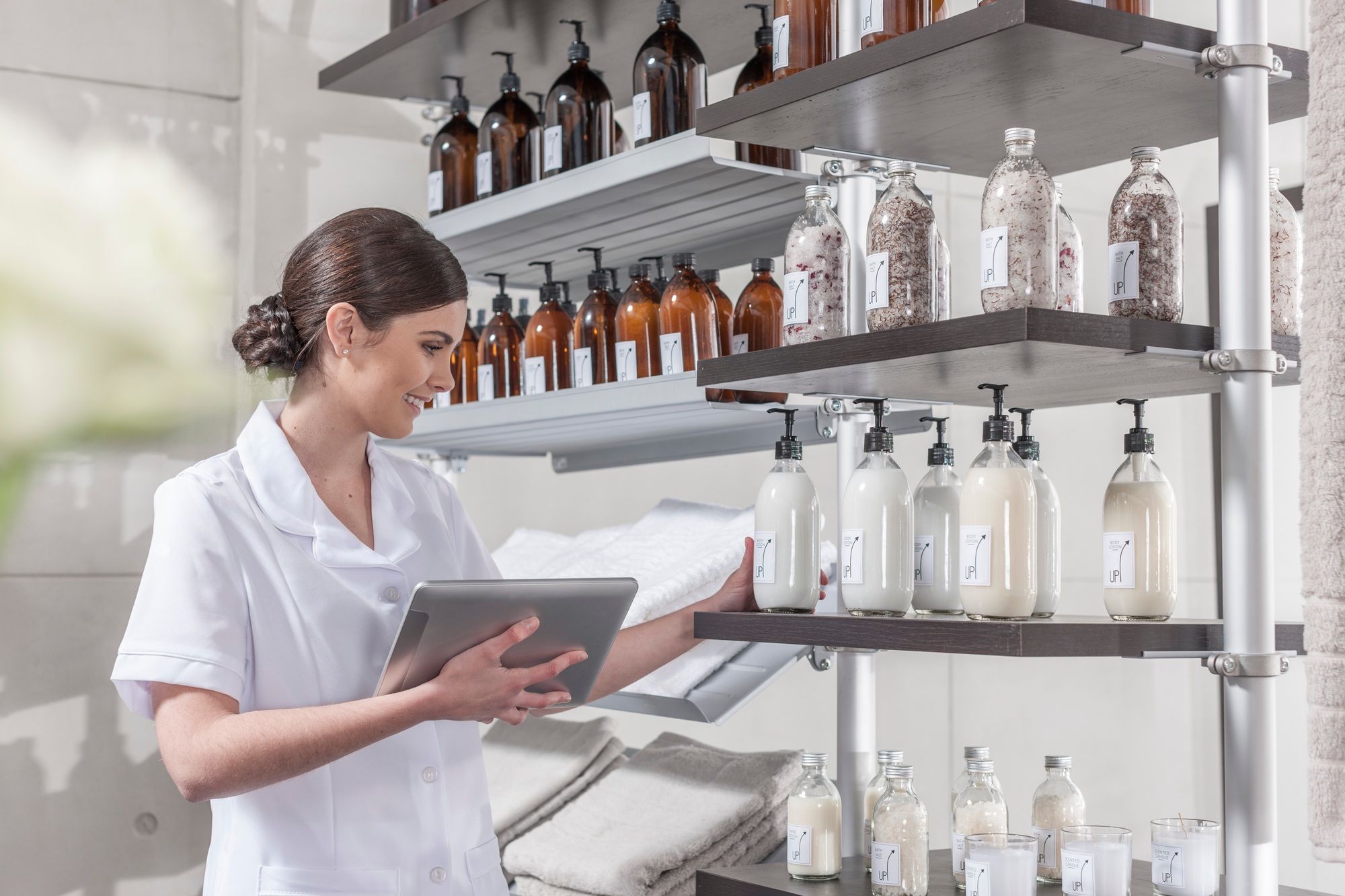 Shop assistant in wellness shop checking the stock