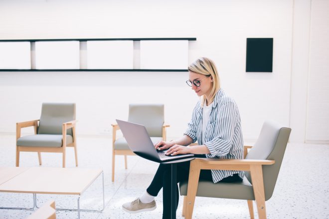 skilled female making web money transaction