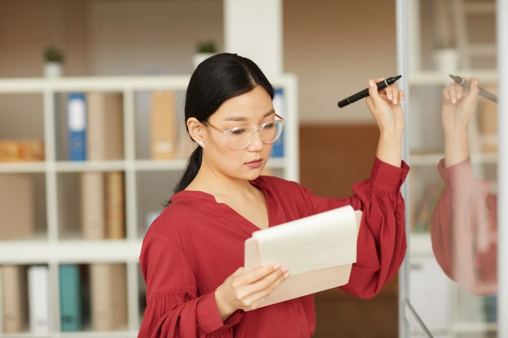 Successful Asian Businesswoman Planning Project