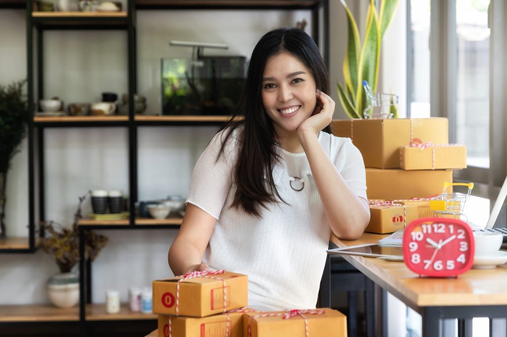 Successful entrepreneur business woman with online sales and Parcel shipping in her home office.