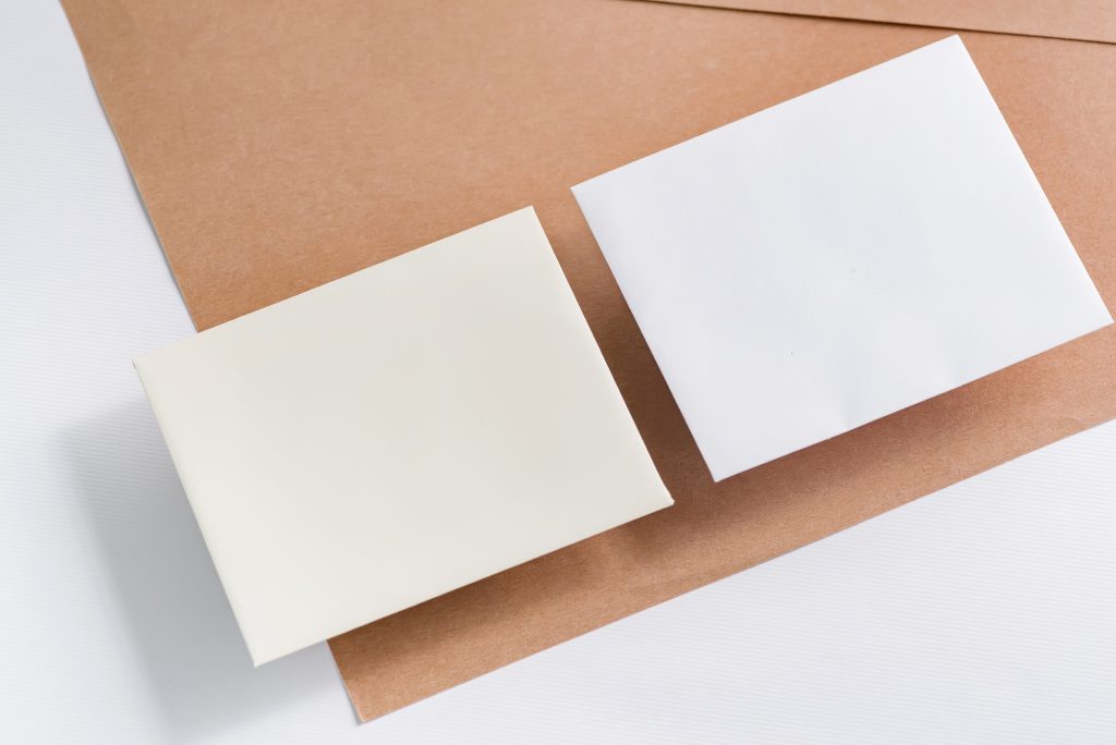 Two blank business cards on a duotone background. Template for branding identity