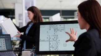 Woman working in room floor planner software